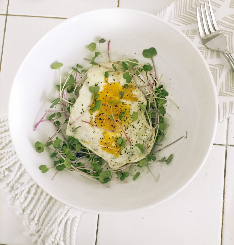 So pretty, purple sprouting broccoli microgreens on a perfect egg